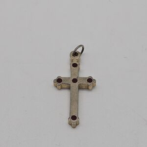 cross pendant with red dots